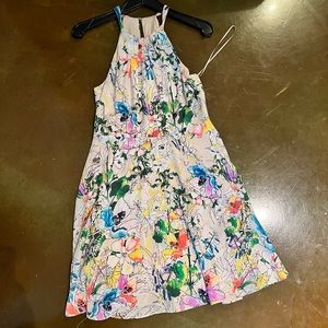 White, floral dress with peep hole over shoulders